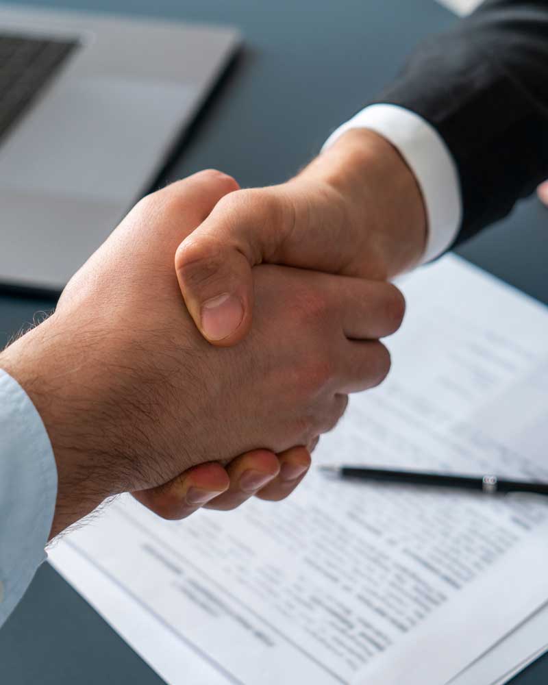 sale of business handshake | Plymouth MA Attorney Law Firm